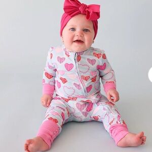 Posh peanut convertible 1 piece. Never worn. Tags still on 9-12 months